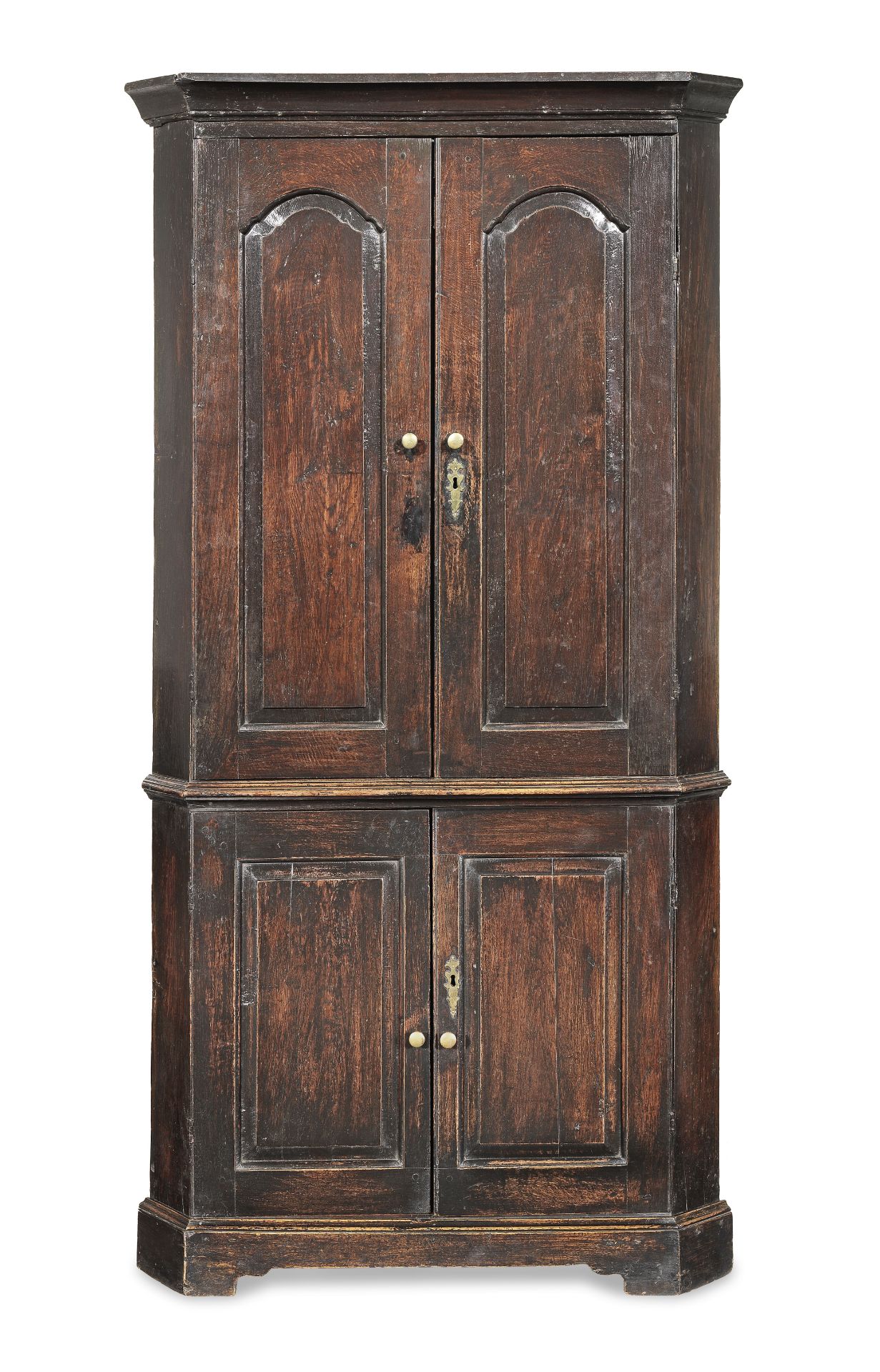 A George II joined oak standing corner cupboard, circa 1740