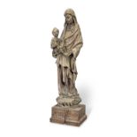 A carved limewood statue, The Virgin teaching Christ to read In the 15h century manner