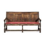 An early 18th century joined oak settle, English, circa 1710-30