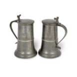 A good pair of George II pewter London-made tall flat-lid flagons, English ale gallon capacity, S...