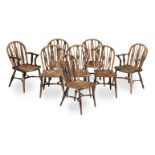 A matched set of early 19th century eight yew, ash and elm Windsor chairs, attributed to the Prio...