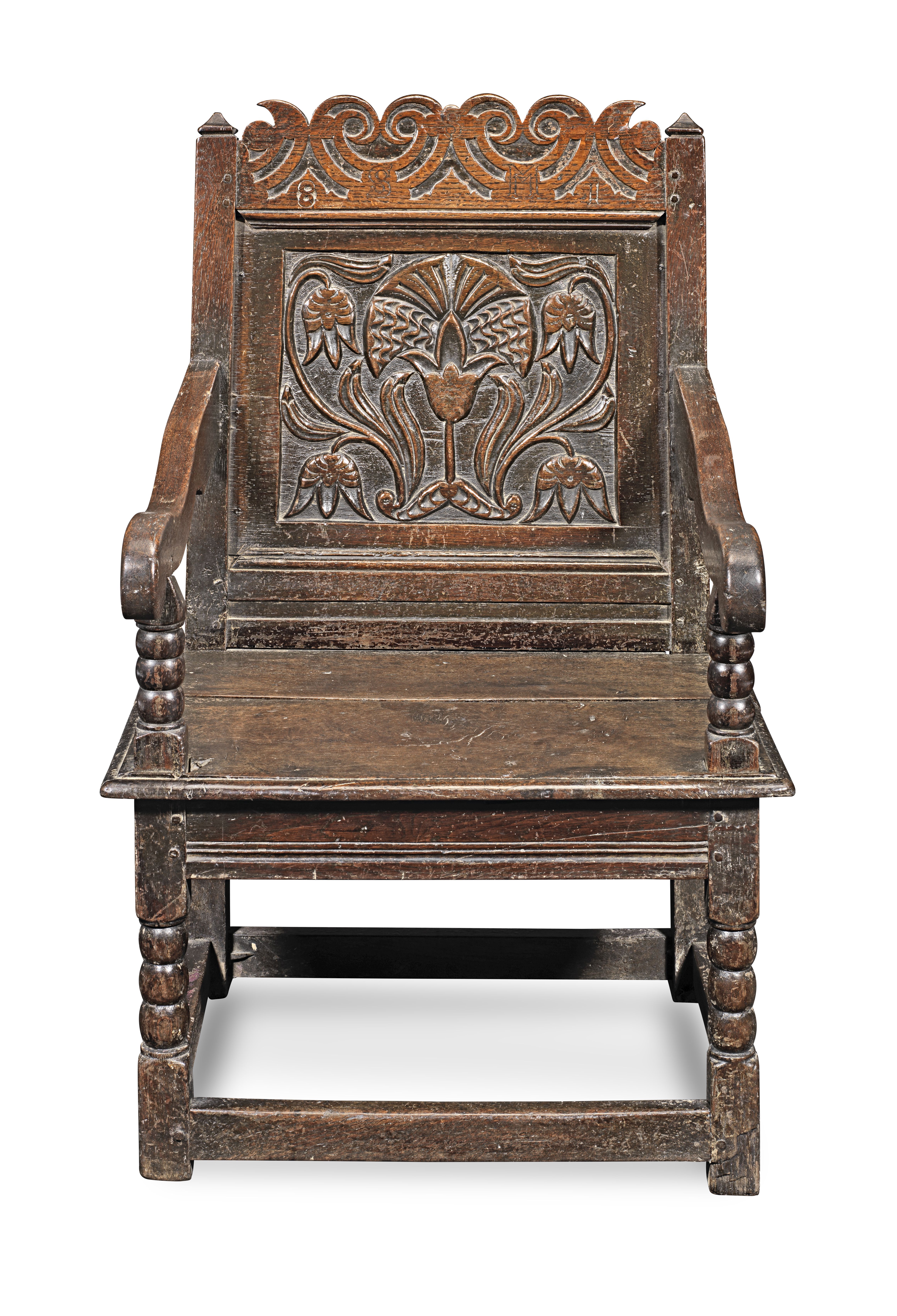 A Charles I joined oak panel-back open armchair, Cheshire/Lancashire, circa 1680, part dated