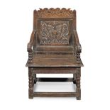 A Charles I joined oak panel-back open armchair, Cheshire/Lancashire, circa 1680, part dated