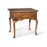 A George II walnut and featherbanded lowboy, circa 1730