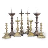 A pair of 17th century brass alloy pricket candlesticks, Italian (8)