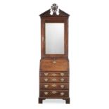 A narrow George I mahogany bureau cabinet, circa 1750 and later