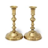 A pair of early to mid-18th century brass socket candlesticks, French/English, circa 1720 (4)