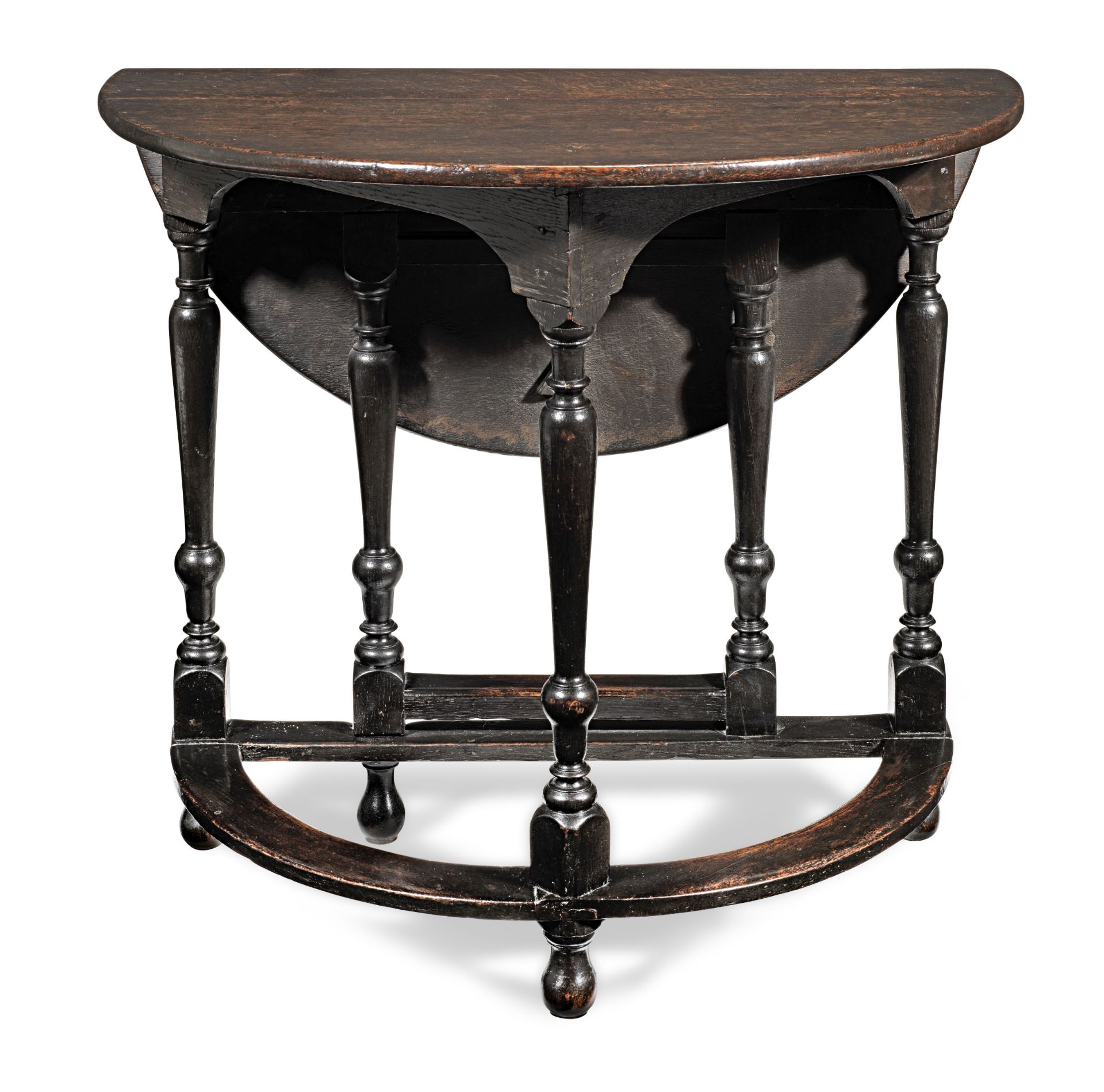 A William & Mary joined oak fold-over demi-lune table, circa 1690