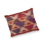 A large cushion made from 19th century silk Ikat and natural-dyed linen