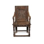 A Charles I joined oak panel-back open armchair, Gloucestershire, circa 1630