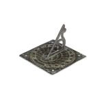 A small bronze sundial plate, probably for use on a window sill