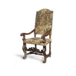 A joined walnut and needlework upholstered open armchair, French, circa 1700-20