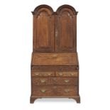 A George I joined oak double-dome bureau cabinet, circa 1720