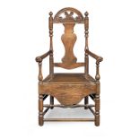 An early 18th century walnut, fruitwood and ash commode open armchair, Welsh, circa 1725