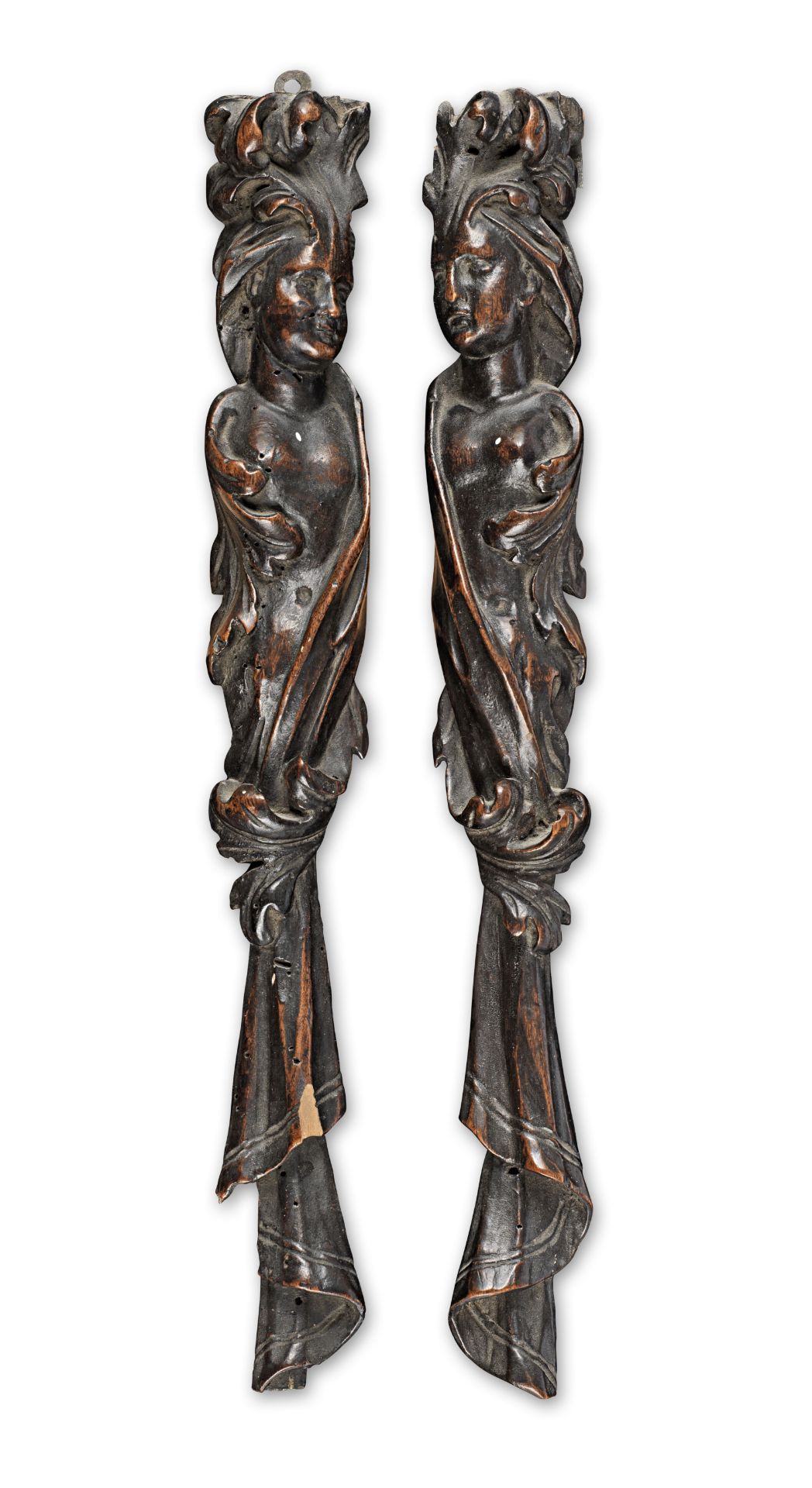 A pair of late 17th century walnut figural appliqu&#233;s (2)