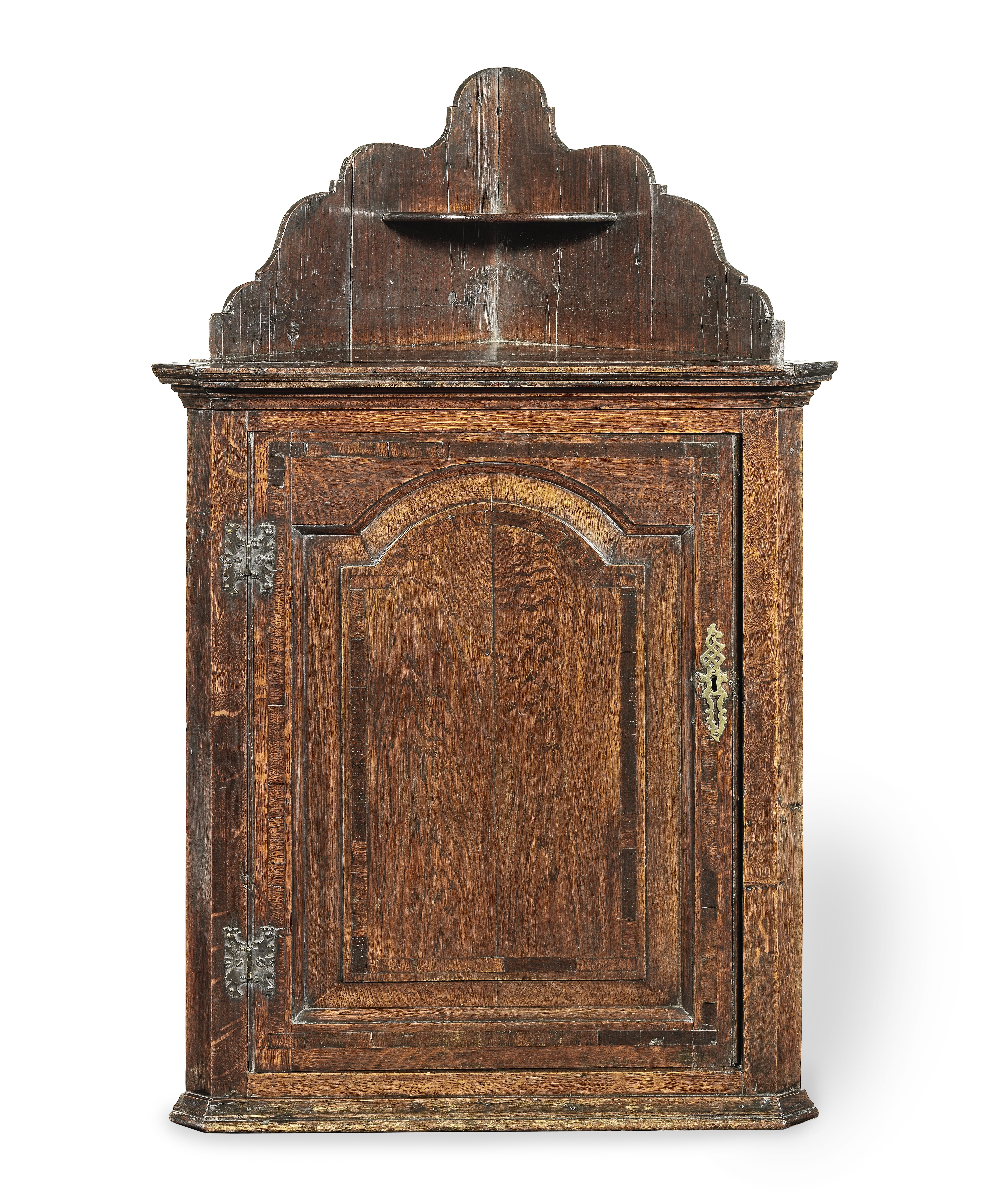 A George II oak, pine and crossbanded mural corner cupboard, circa 1740