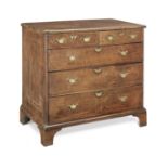A rare George II oak and inlaid chest of drawers, dated 1731