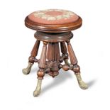 A Victorian stained-beech revolving piano stool, circa 1850
