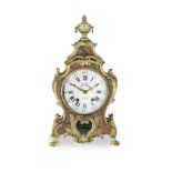 A 19th century Louis XV style embossed leather and 'ormolo mounted' Rococo mantel clock