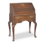 A small George I joined oak desk-on-stand, circa 1720