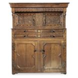 A Queen Anne joined oak and inlaid press cupboard, Lancaster area, dated 1712