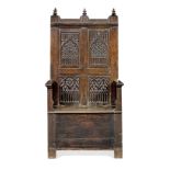 An early 16th century joined oak high-back enclosed box-settle, Franco-Flemish, circa 1530 and later