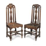 Two similar and unusual early 18th century oak high-back chairs, English, circa 1710-20 (2)
