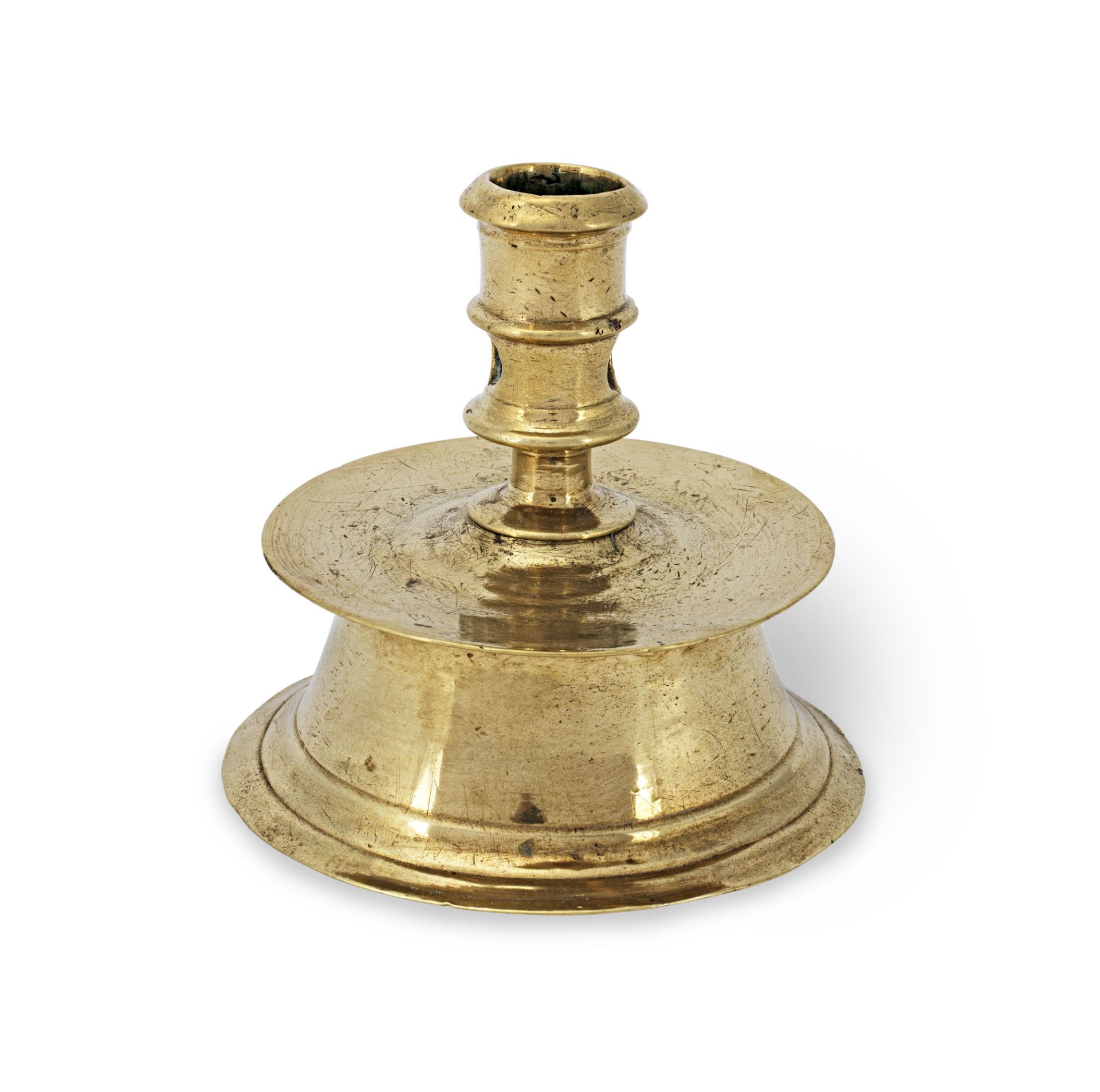 A 16th century brass alloy capstan socket candlestick, North-West European