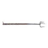 A 19th century iron and fruitwood toasting fork
