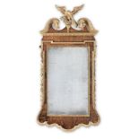 A George II style walnut and parcel-gilt mirror