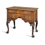 A George II walnut and chequer line-inlaid lowboy, circa 1740