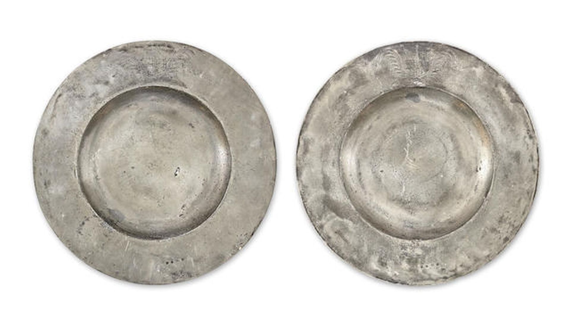 An impressive pair of Charles II pewter broad rim chargers, circa 1670 (2)