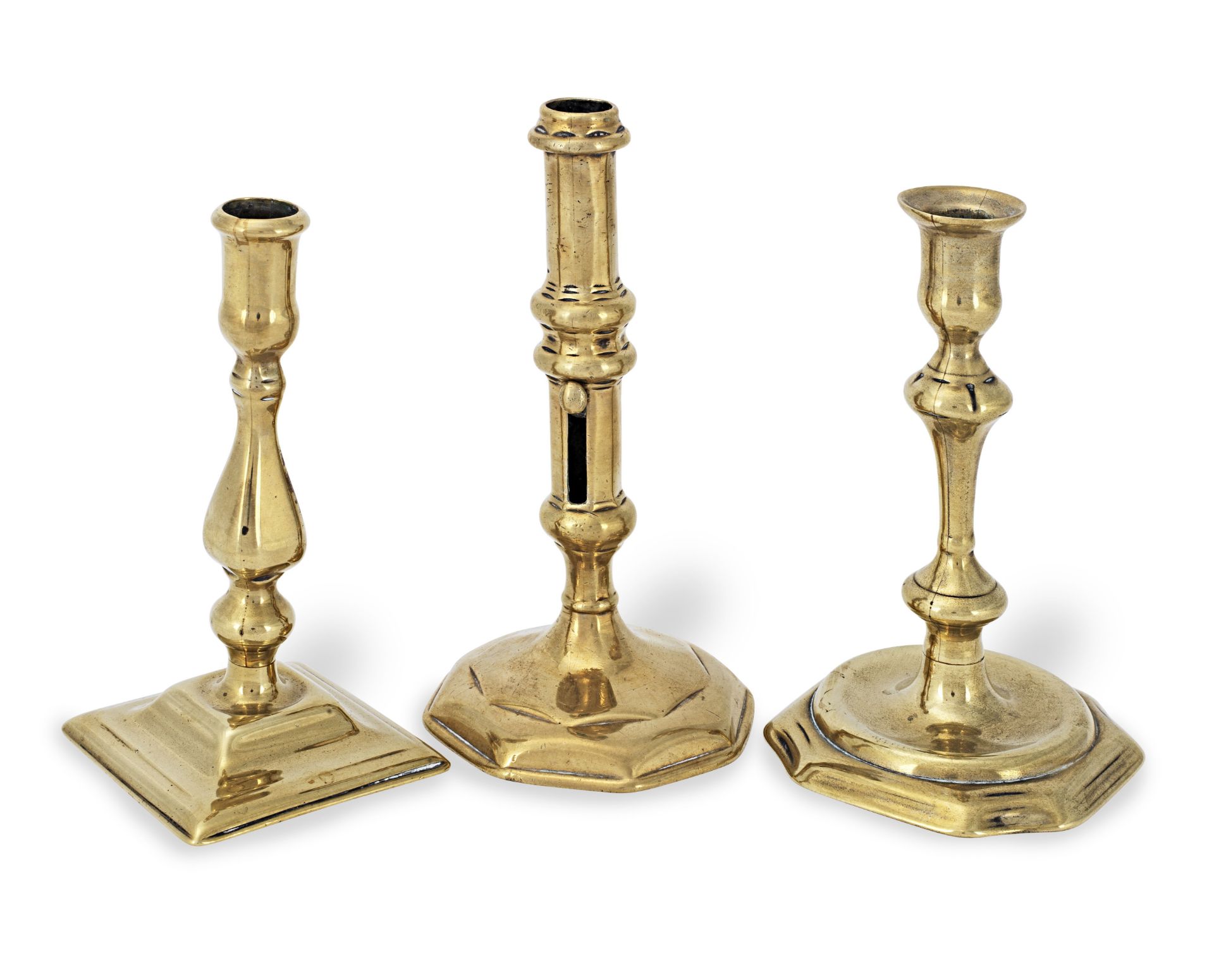 A Queen Anne/George I brass ejector socket candlestick, circa 1705-1720 (3)