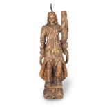 An early to mid-17th century carved softwood figure, probably of a male saint