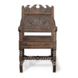 A Charles II joined oak panel-back open armchair, Lancashire, circa 1670