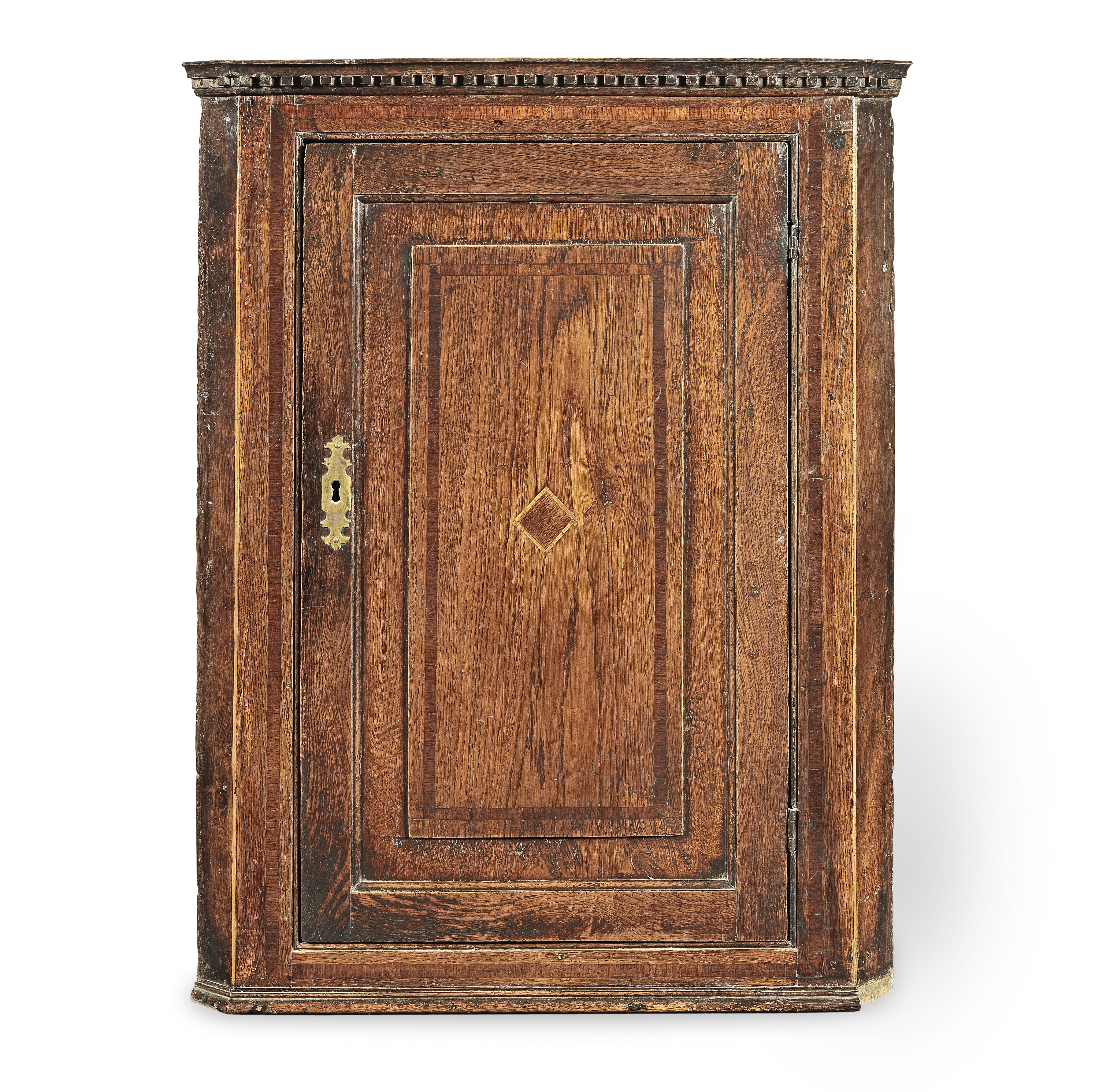 A George III joined oak and fruitwood inlaid mural corner cupboard, circa 1790