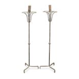 A pair of wrought iron floor standing candleholders (2)