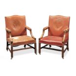 A pair of mahogany Gainsborough armchairs elements apparently 18th century (2)
