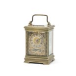 An attractive and unusual late 19th / early 20th century French brass carriage clock with tri-col...