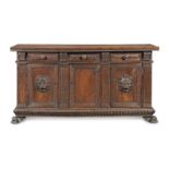 An Italian late 16th/early 17th century carved walnut credenza probably of Tuscan origin