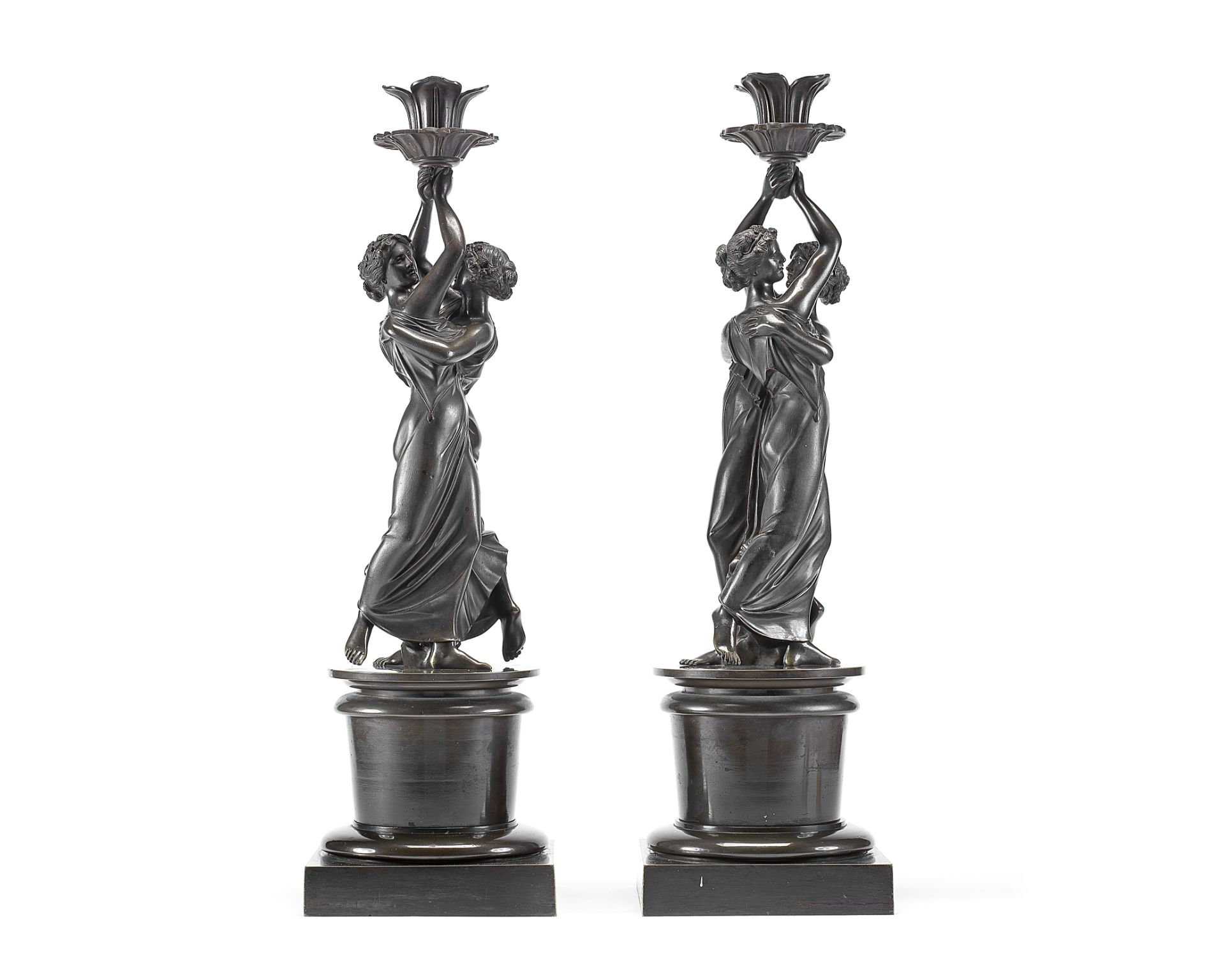 A pair of mid 19th century patinated bronze figural candlesticks (2)