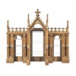 A large set of gothic revival oak and parcel gilt hanging shelves probably adapted from a larger ...