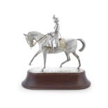 A rare cast silver model of HM Queen Elizabeth II on her horse Winston commissioned by Richard Ja...