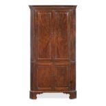 A George II mahogany two-tier corner cabinet