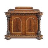 A large mid Victorian figured mahogany and birds' eye maple cellaret of sarcophagus form