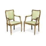 A pair of French late 19th century carved giltwood salon fauteuils in the Louis XVI style (2)