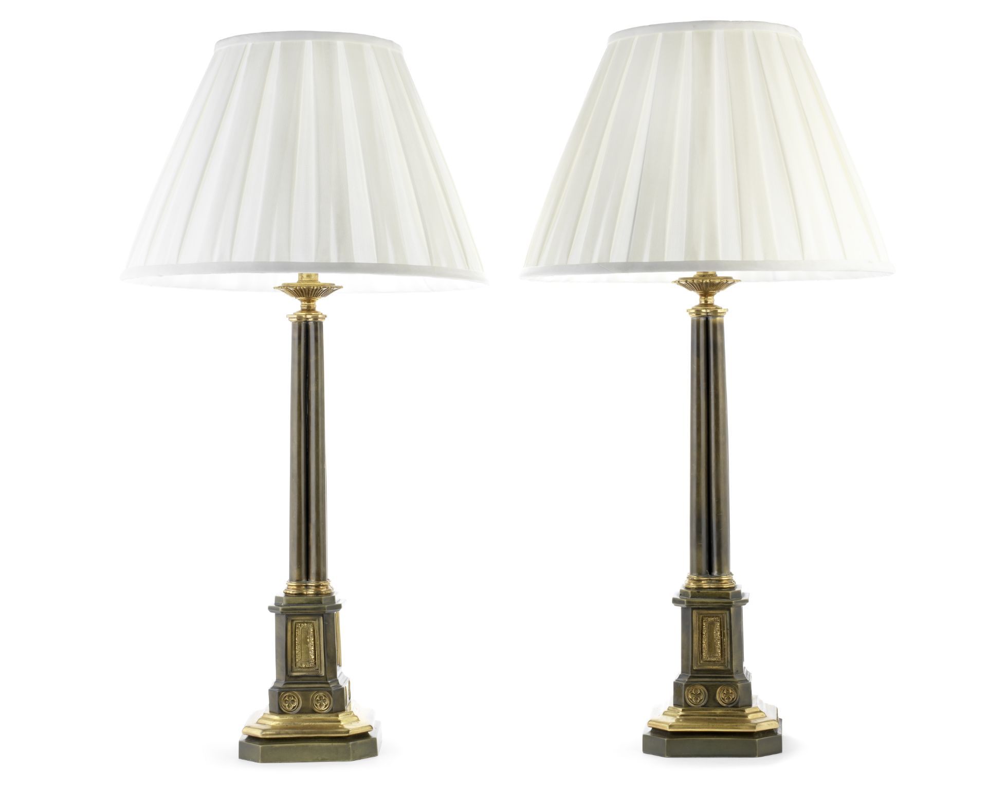 A pair of patinated and gilt metal lamp bases in the regency gothic style (4)