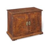 An early 18th century and later walnut veneered table cabinet