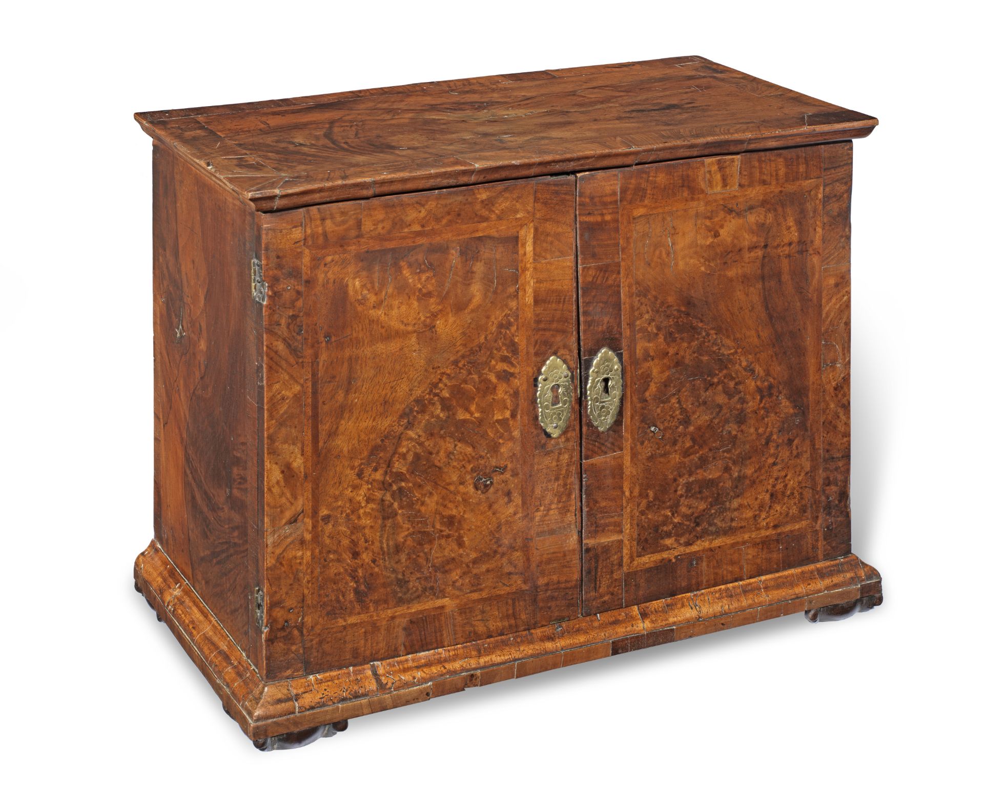 An early 18th century and later walnut veneered table cabinet