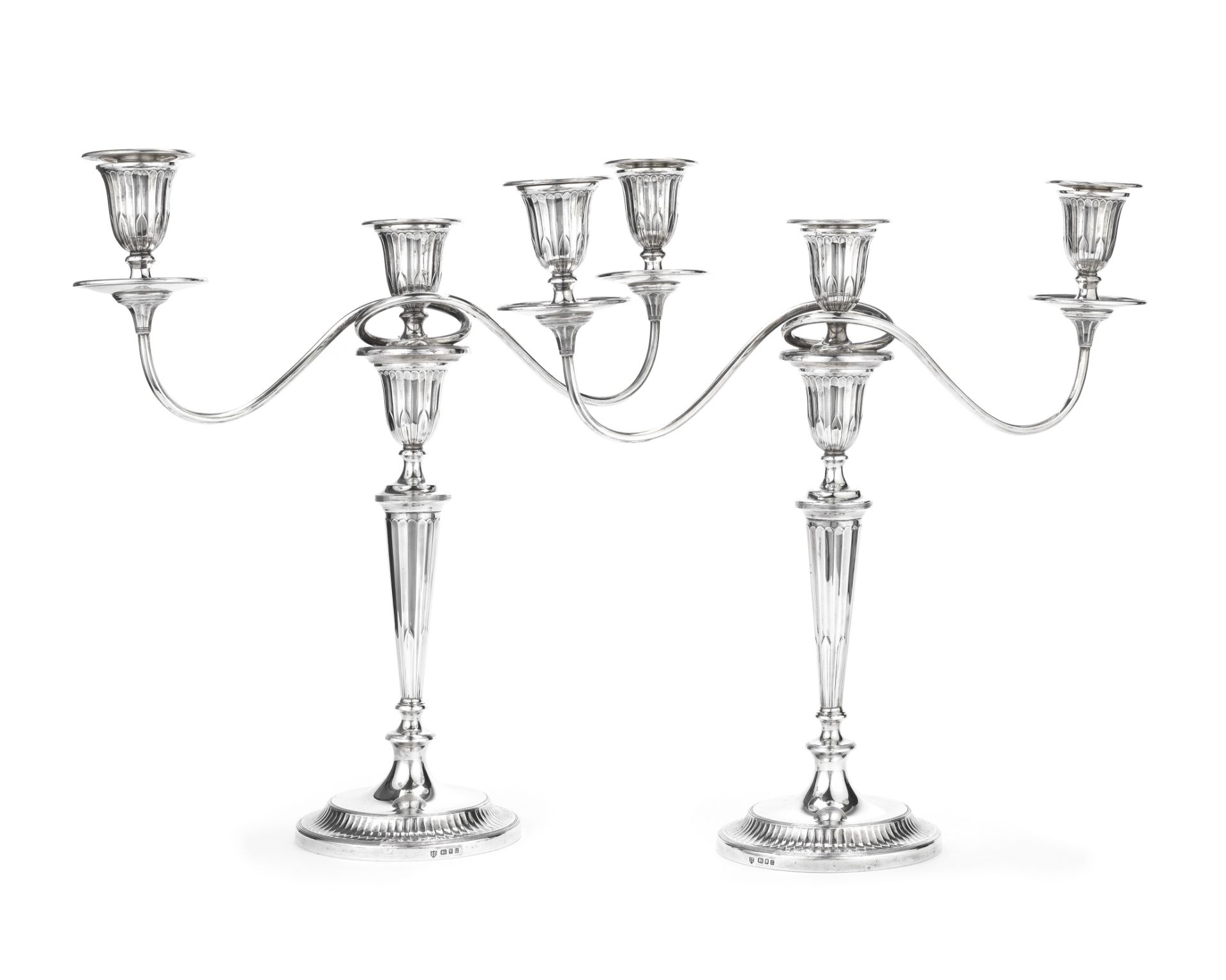 A pair of silver three-light candelabra Tessiers, London 1935 / 1938